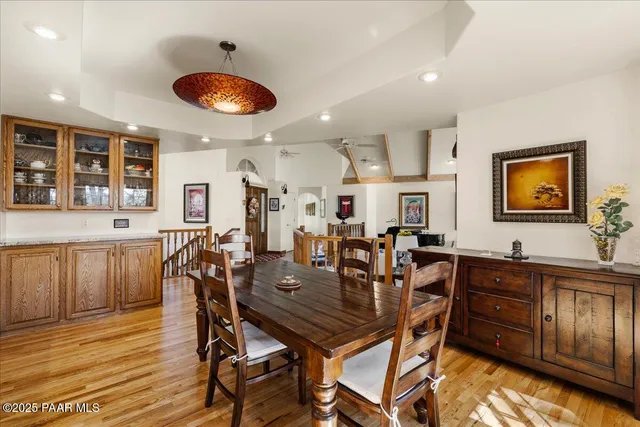 a kitchen with stainless steel appliances granite countertop a stove refrigerator and cabinets