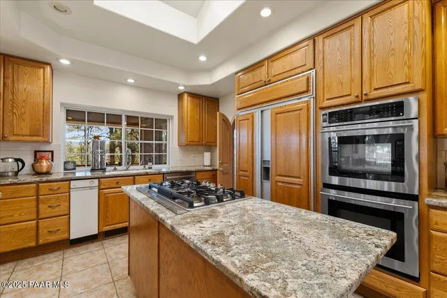 a room with furniture and book shelf