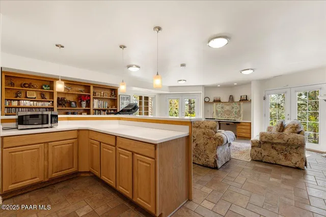 a spacious bedroom with two beds and large window