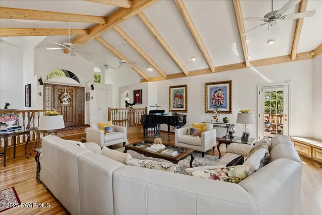 a living room with furniture or couch and a wooden floor