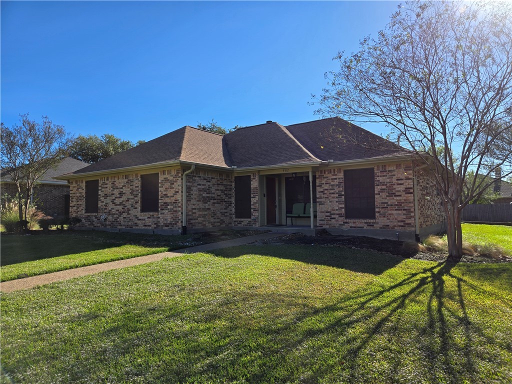 4512 Kensington Road Bryan, TX 77802 - Photo 1 of 1 Ranch-style home featuring a front lawn