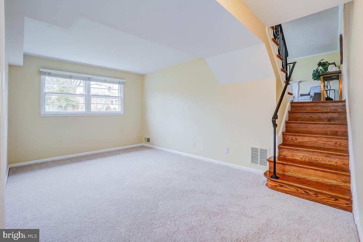 6503 Dryden Drive McLean, VA 22101 - Photo 23 of 34 a view of an empty room with stairs and a window