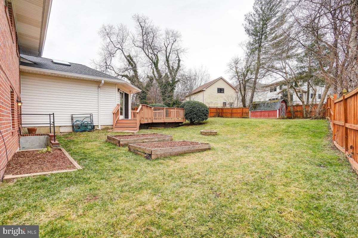 6503 Dryden Drive McLean, VA 22101 - Photo 31 of 34 a view of a yard with a house and a large tree