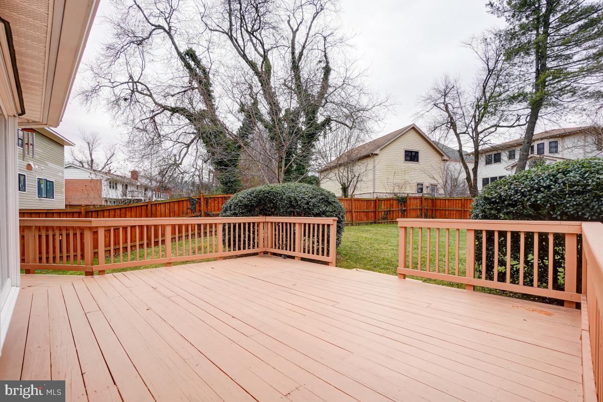 6503 Dryden Drive McLean, VA 22101 - Photo 32 of 34 a view of a deck with wooden floor and fence with a large garden