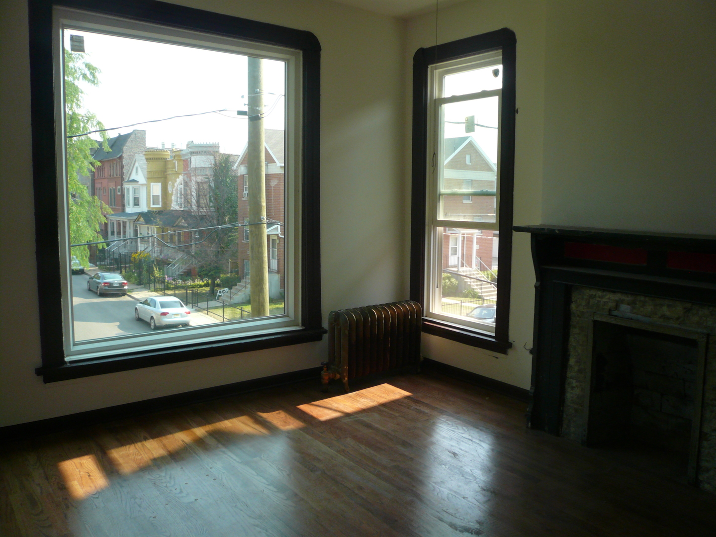 1132 East 44th Street Chicago, IL 60653 - Photo 17 of 23 a view of empty room with wooden floor and fan
