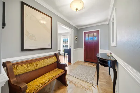 a living room with furniture and a table