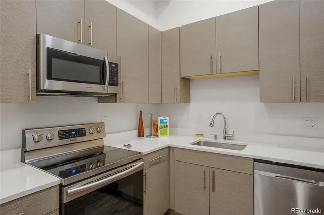 a kitchen with a sink and cabinets
