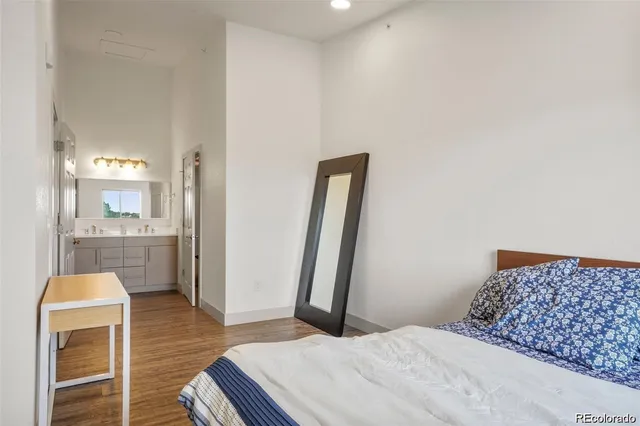 a bedroom with a bed and bathroom