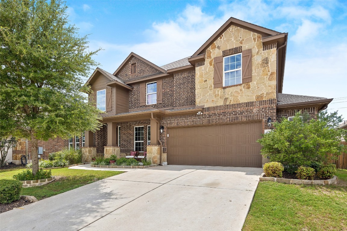 8512 High Summit Lane Austin, TX 78737 - Photo 1 of 1 a front view of a house with a yard and garage