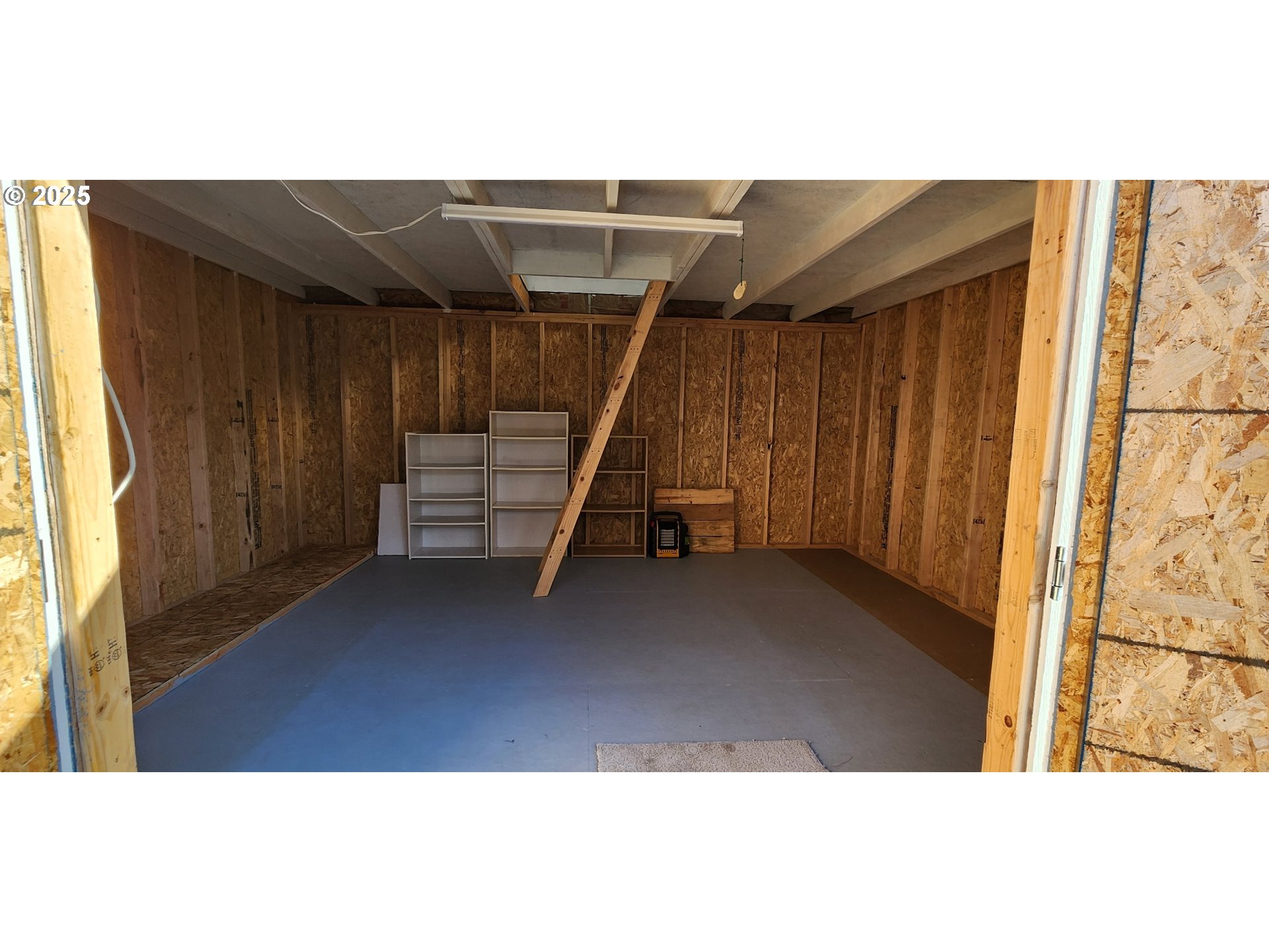 94273 Leith Road Gold Beach, OR 97444 - Photo 18 of 20 a view of a bedroom with furniture and a window