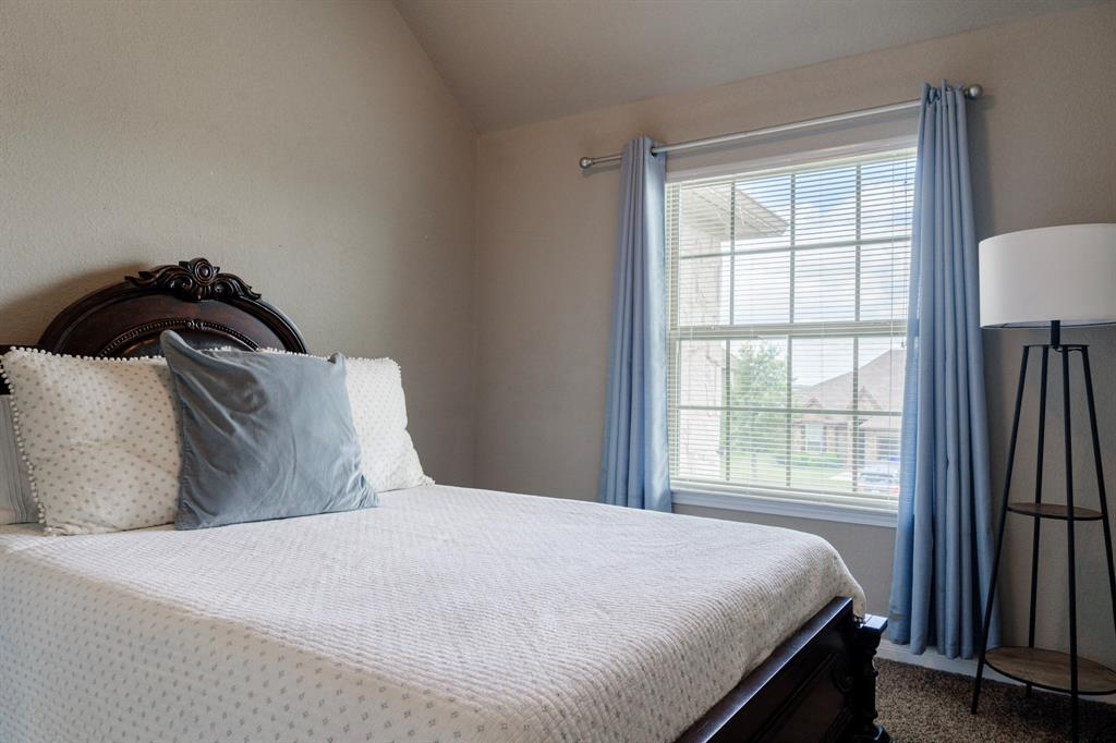 2716 Beutel Road Lorena, TX 76655 - Photo 28 of 39 a bedroom with a bed and a window