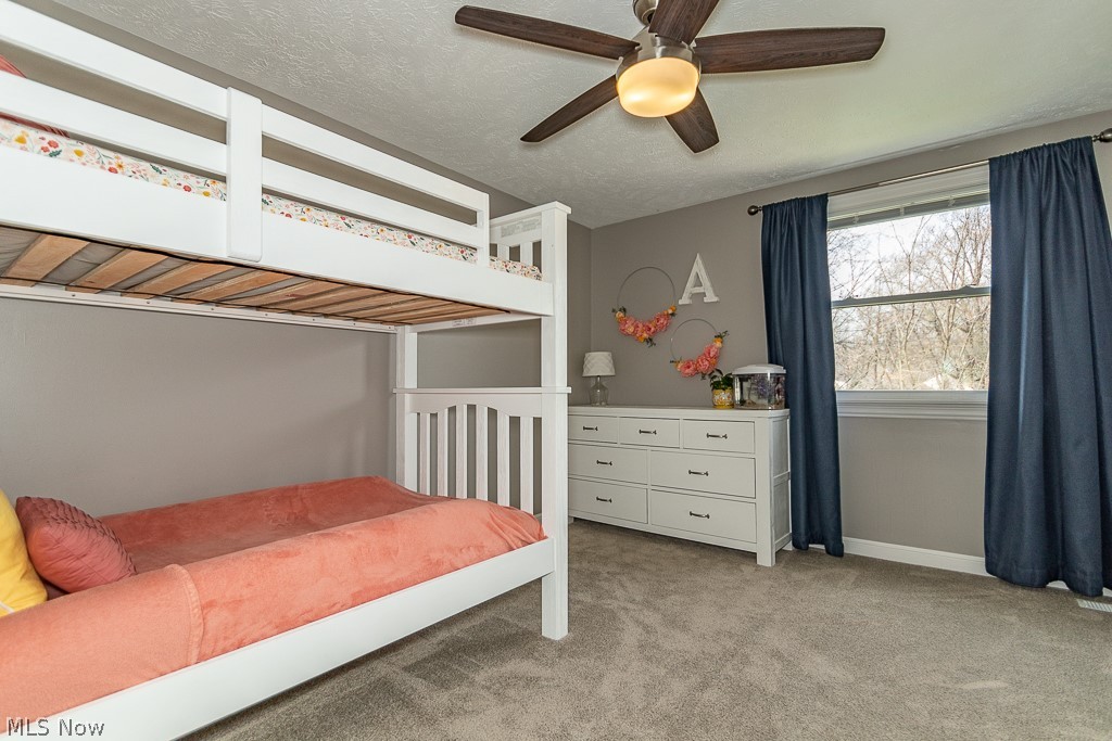 3080 Gale Road Willoughby, OH 44094 - Photo 29 of 45 Bedroom featuring a textured ceiling, light colored carpet, and ceiling fan