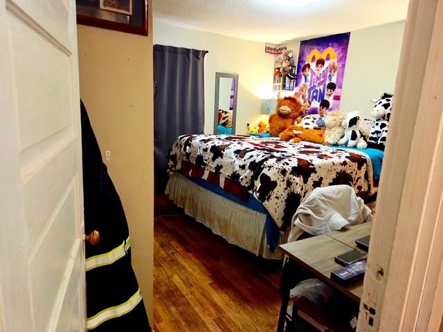 178 South West Street Decaturville, TN 38329 - Photo 11 of 11 a bed sitting in a bedroom next to a window