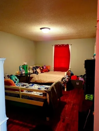 a room with furniture and flat screen tv
