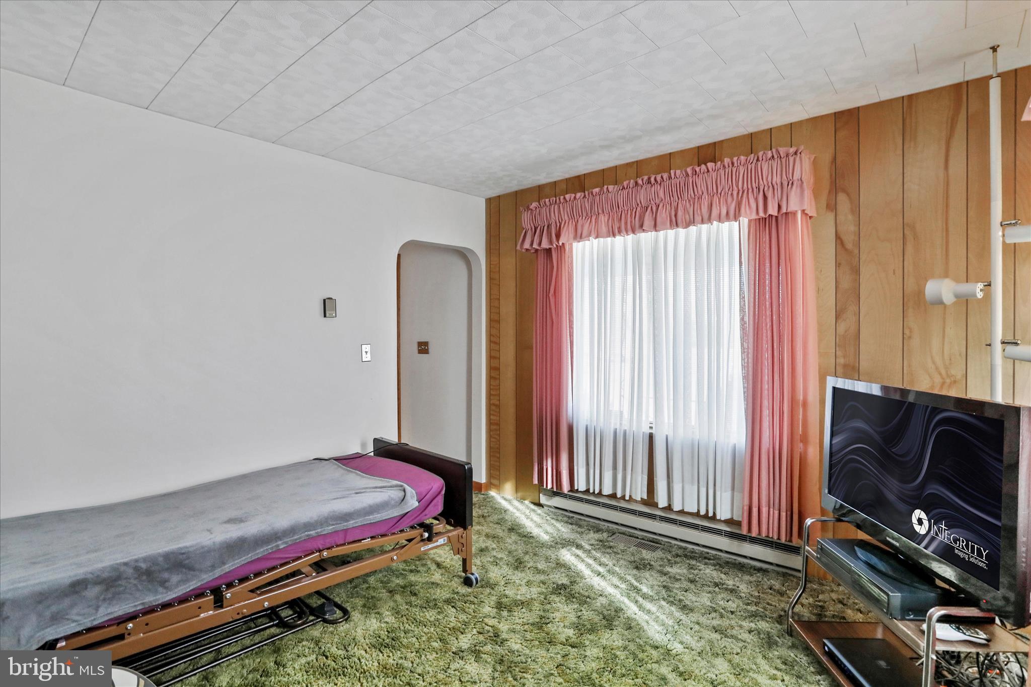 14111 Green Ridge Road Northeast Flintstone, MD 21530 - Photo 12 of 24 a room with a bed and a television