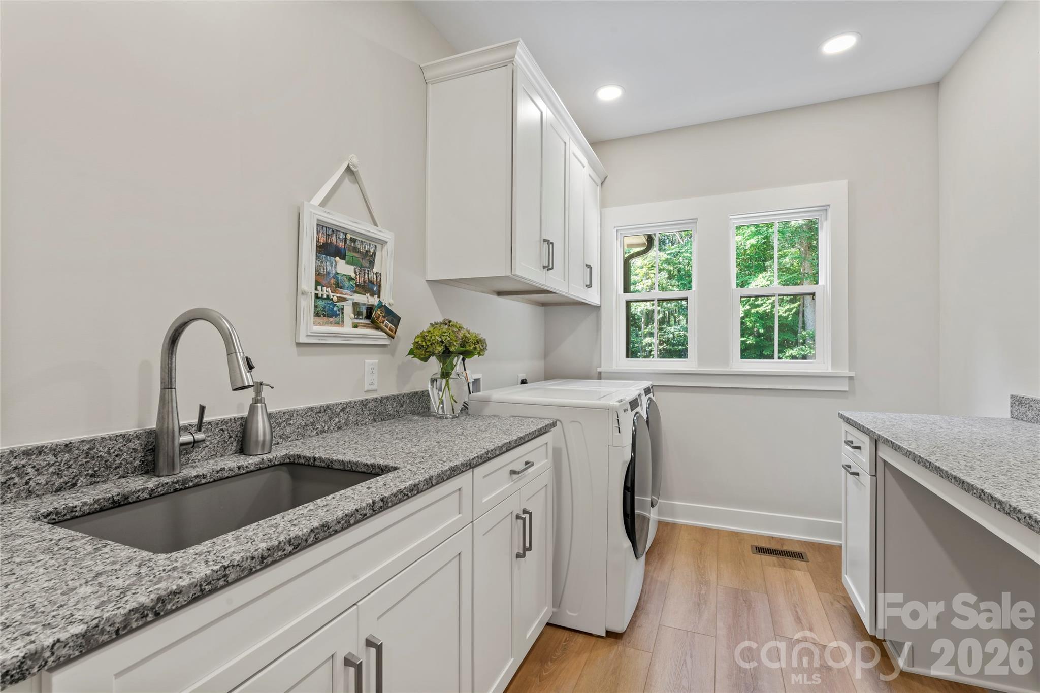 2866 Backwoods Trail Denver, NC 28037 - Photo 15 of 44 a kitchen with a sink cabinets and window