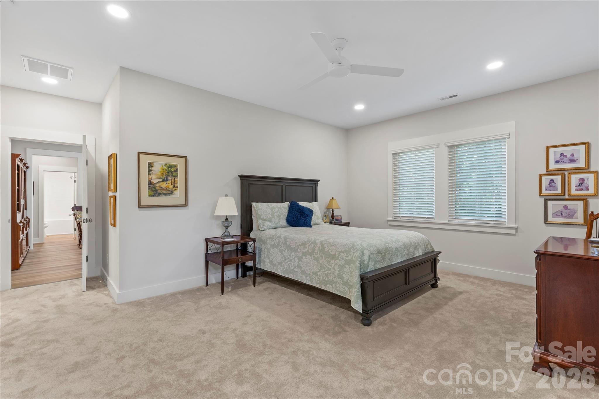 2866 Backwoods Trail Denver, NC 28037 - Photo 28 of 44 a bedroom with a bed and a table in it