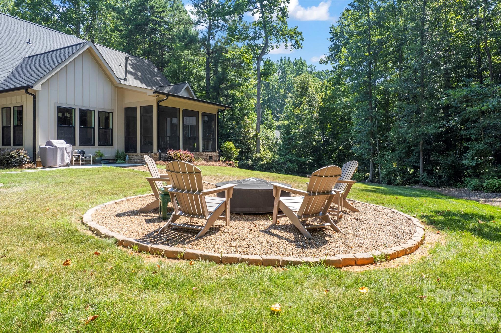 2866 Backwoods Trail Denver, NC 28037 - Photo 35 of 42 a view of a house with backyard sitting area and garden