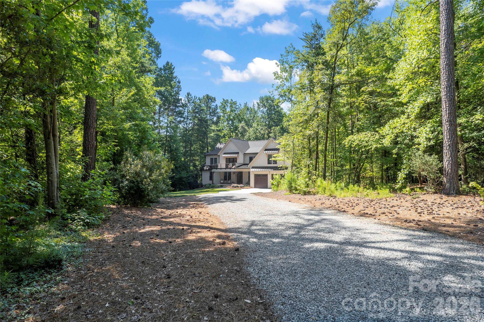 2866 Backwoods Trail Denver, NC 28037 - Photo 4 of 44 a front view of a house with a yard and garage