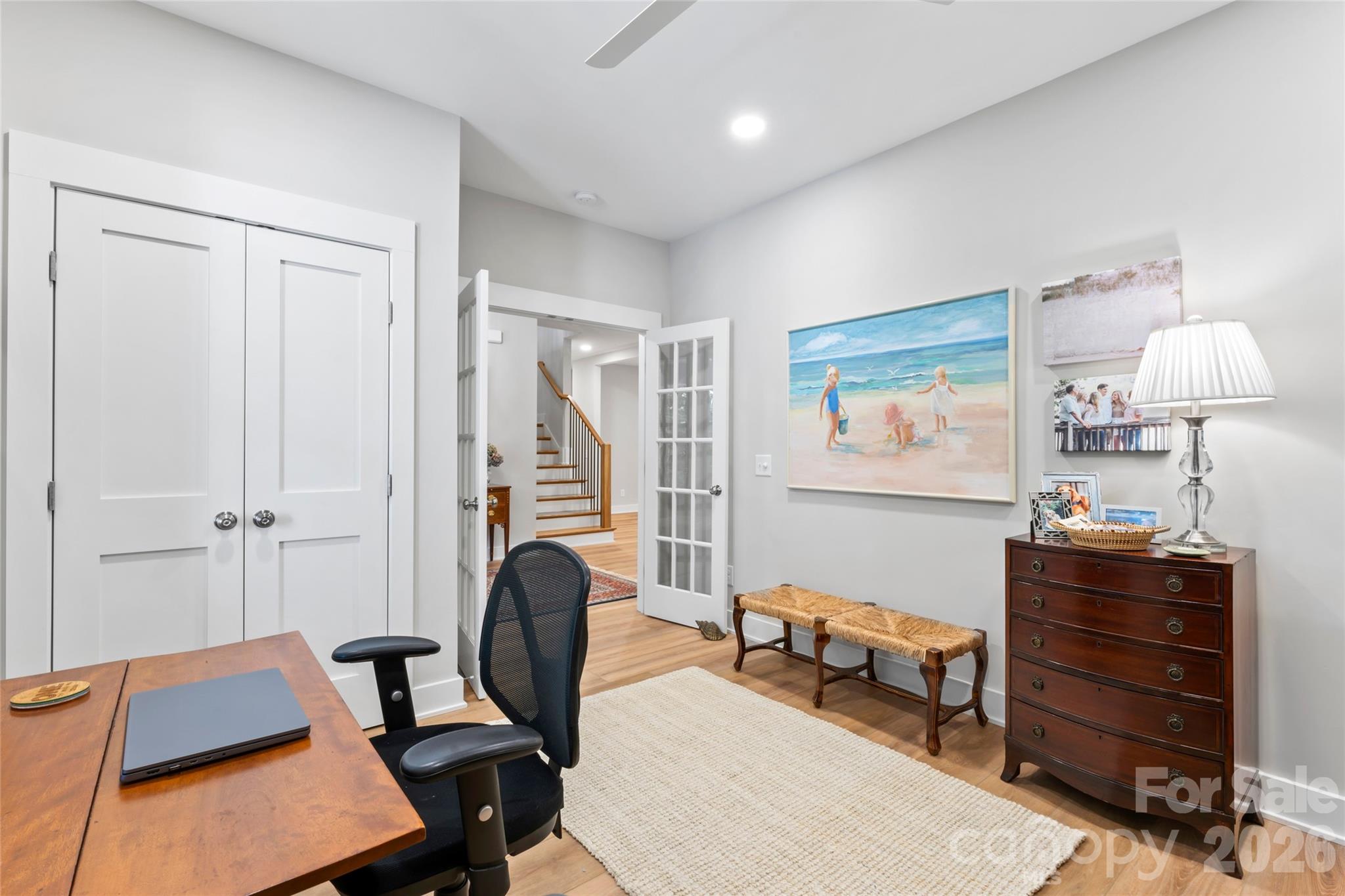 2866 Backwoods Trail Denver, NC 28037 - Photo 8 of 44 a room with furniture a desk and chair with wooden floor
