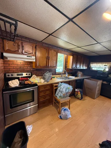 a bed room with furniture and a flat screen tv