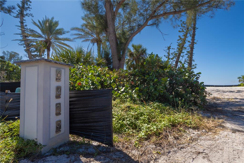 6429 Gulfside Road Longboat Key, FL 34228 - Photo 14 of 20 a couple of potted plants in front of house