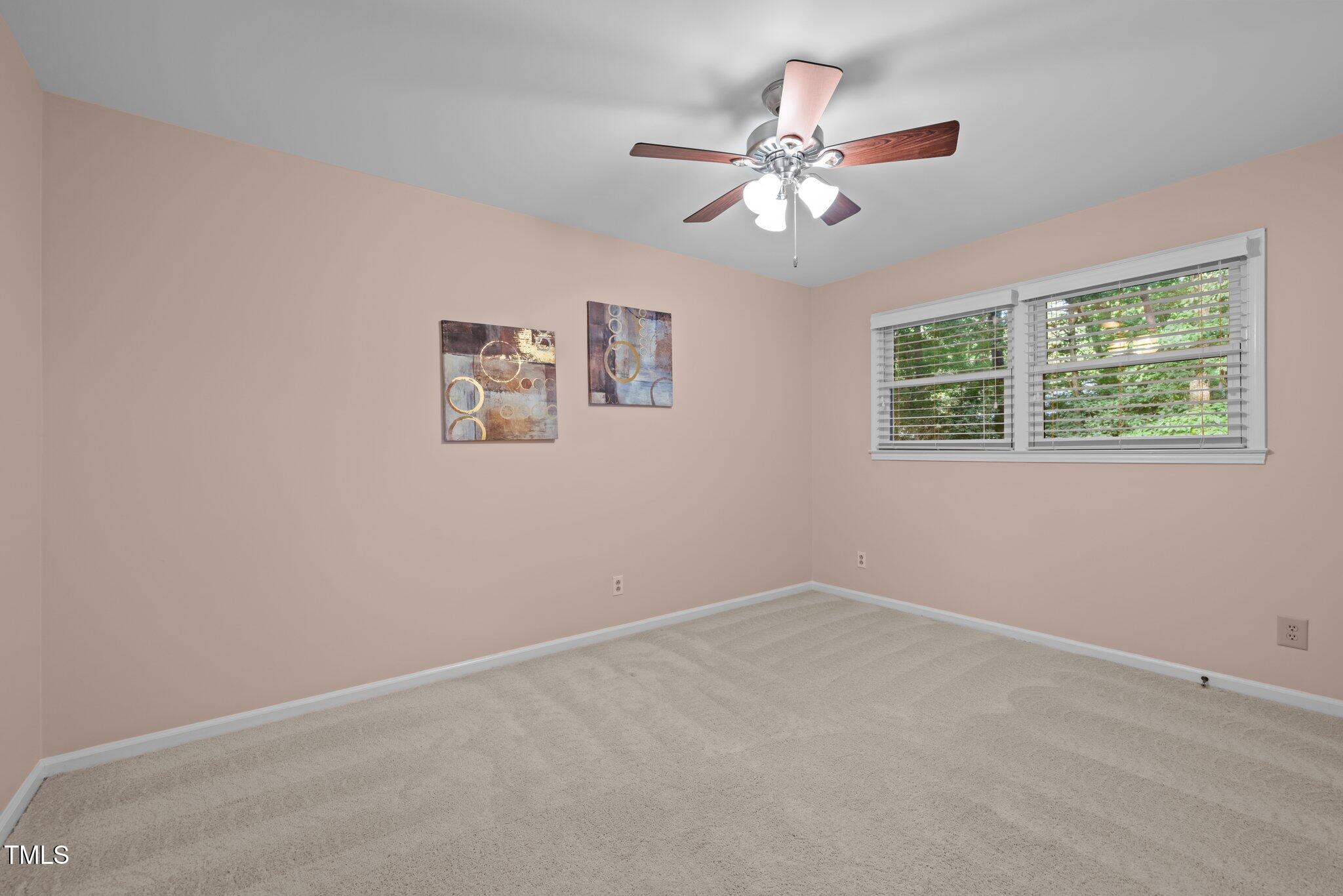 6925 Valley Lake Drive Raleigh, NC 27612 - Photo 36 of 50 a view of an empty room with a window