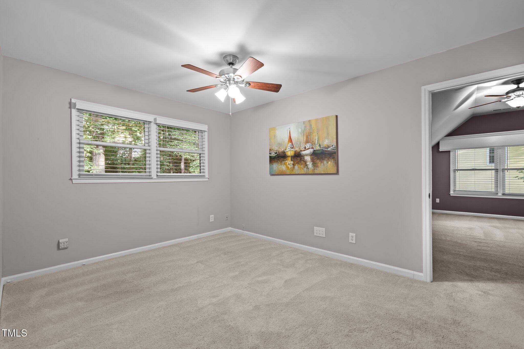 6925 Valley Lake Drive Raleigh, NC 27612 - Photo 37 of 50 a view of an empty room with a window