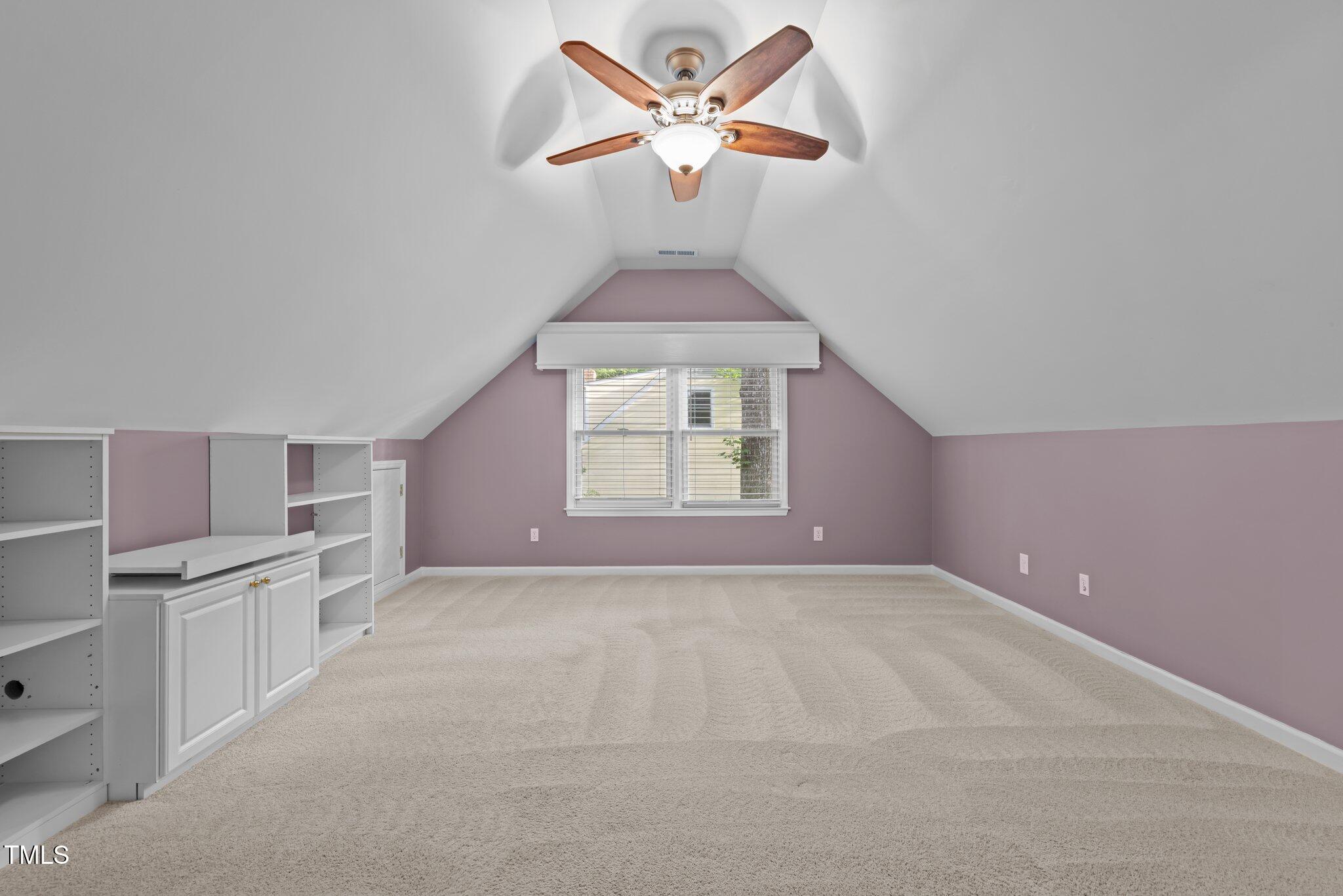 6925 Valley Lake Drive Raleigh, NC 27612 - Photo 39 of 50 a view of a kitchen with a ceiling fan and a window