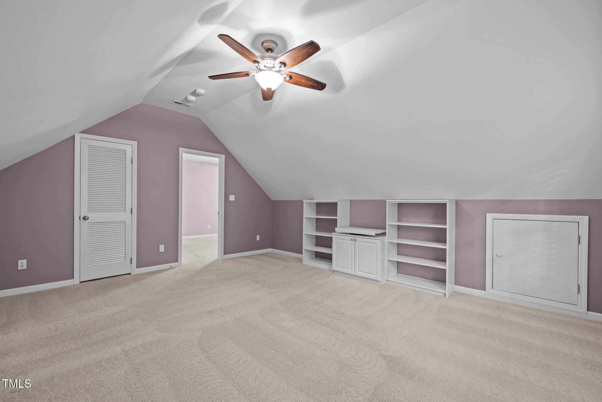 6925 Valley Lake Drive Raleigh, NC 27612 - Photo 40 of 50 a view of a livingroom with a ceiling fan