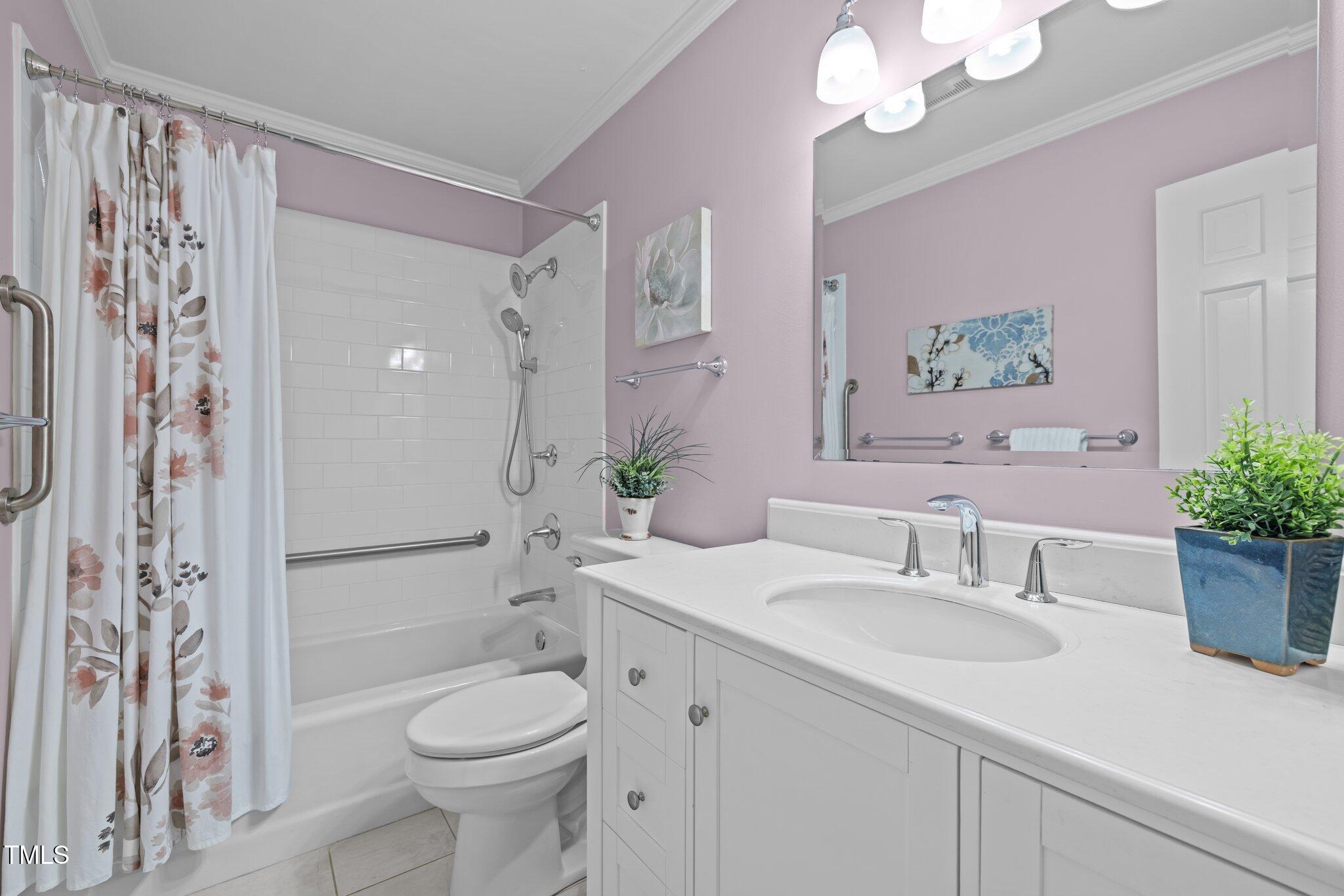 6925 Valley Lake Drive Raleigh, NC 27612 - Photo 41 of 50 a bathroom with a sink a toilet and shower