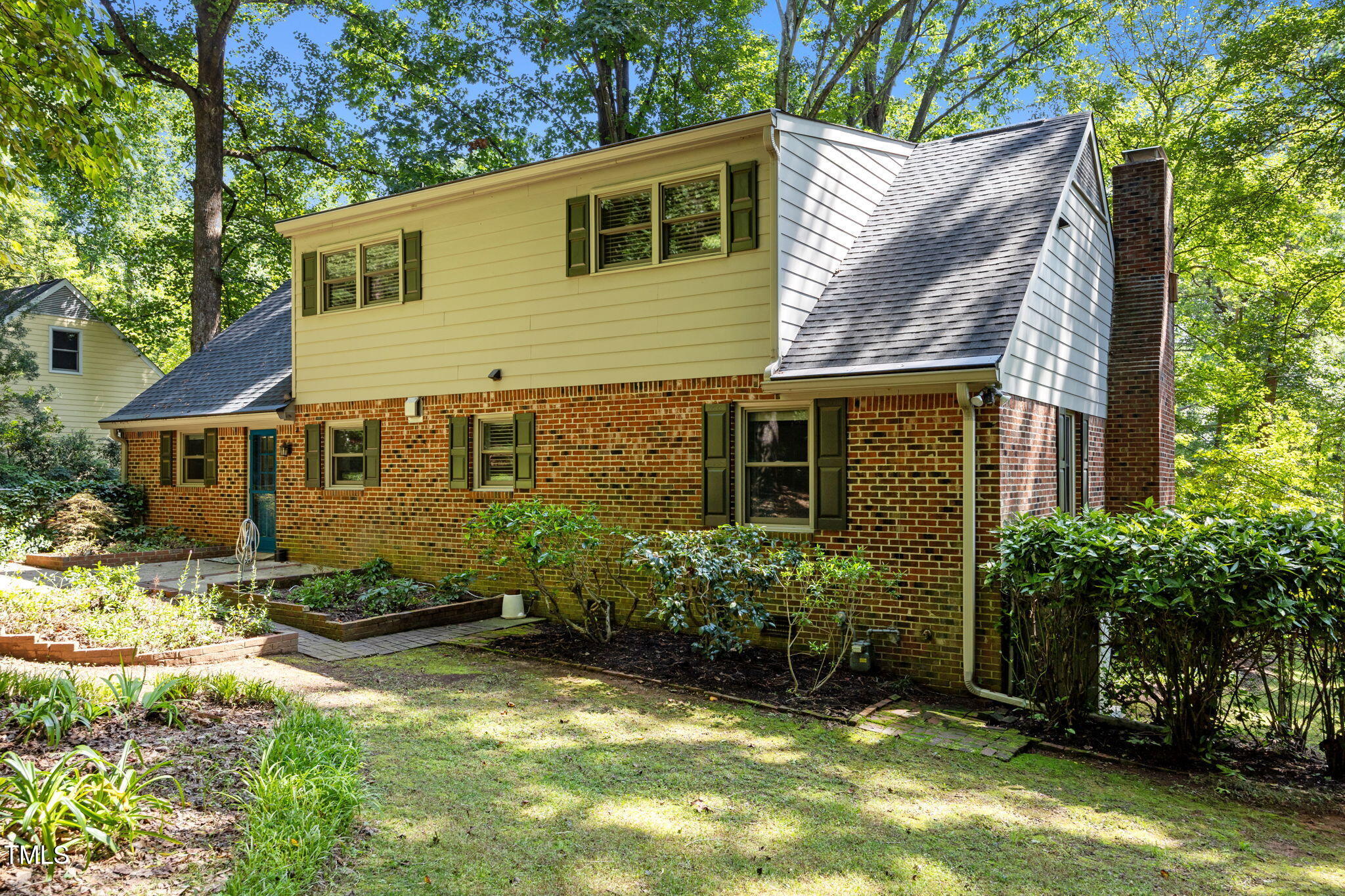 6925 Valley Lake Drive Raleigh, NC 27612 - Photo 46 of 50 a front view of a house with a yard