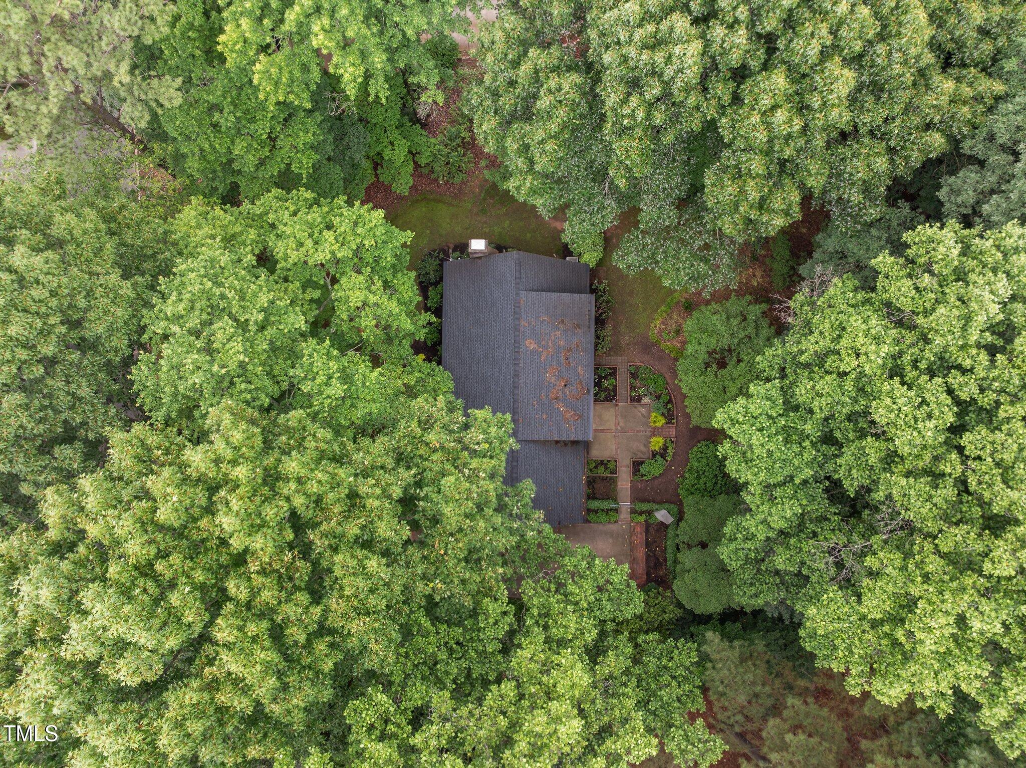 6925 Valley Lake Drive Raleigh, NC 27612 - Photo 47 of 50 an aerial view of a house with a yard and large trees