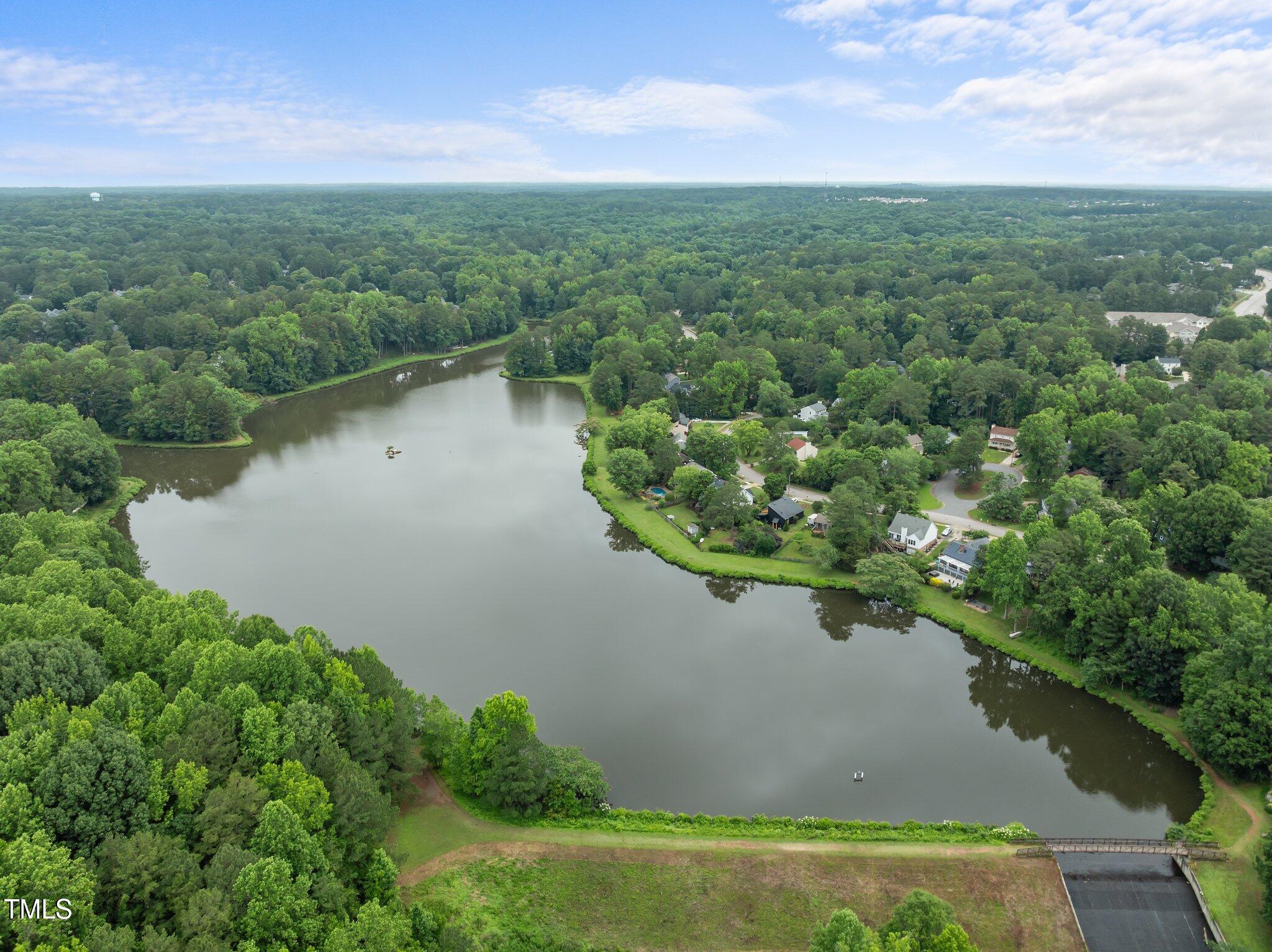 6925 Valley Lake Drive Raleigh, NC 27612 - Photo 50 of 50 a view of a lake with a city