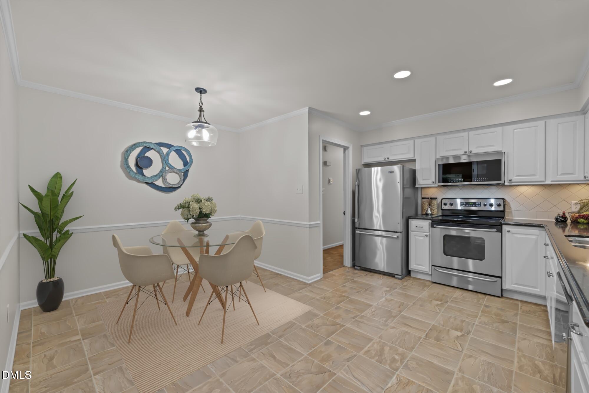 6925 Valley Lake Drive Raleigh, NC 27612 - Photo 8 of 50 a kitchen with granite countertop a counter space cabinets stainless steel appliances and a potted plant