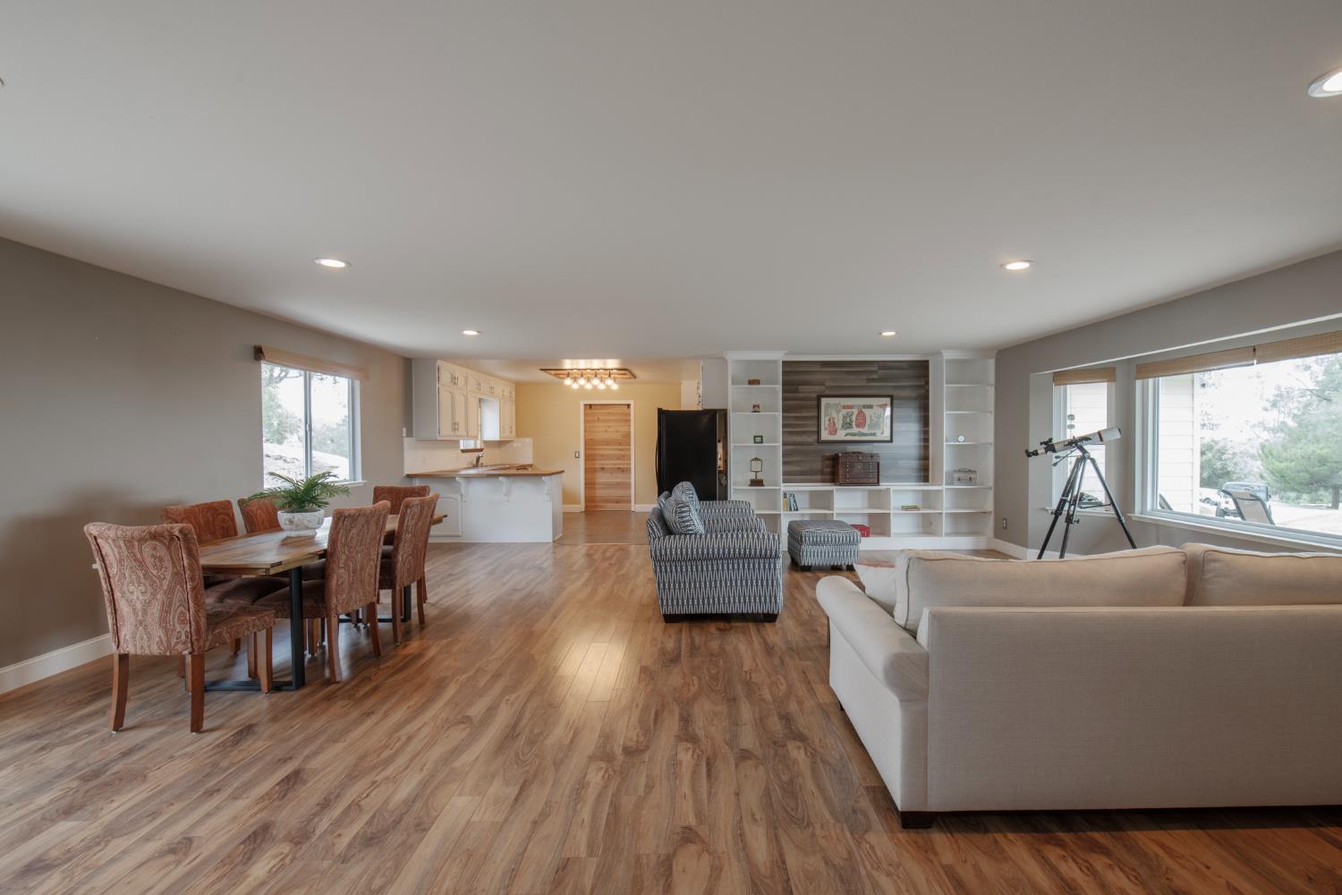 29395 Revis Road Coarsegold, CA 93614 - Photo 12 of 32 a living room with furniture dining table and a large window
