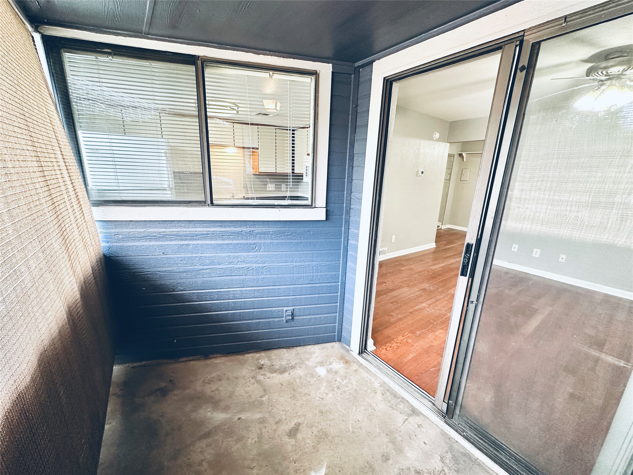 2500 Burleson Road, Unit 209 Austin, TX 78741 - Photo 23 of 24 A quiet enclosed patio with a solid privacy wall and convenient sliding glass door entry to the interior.