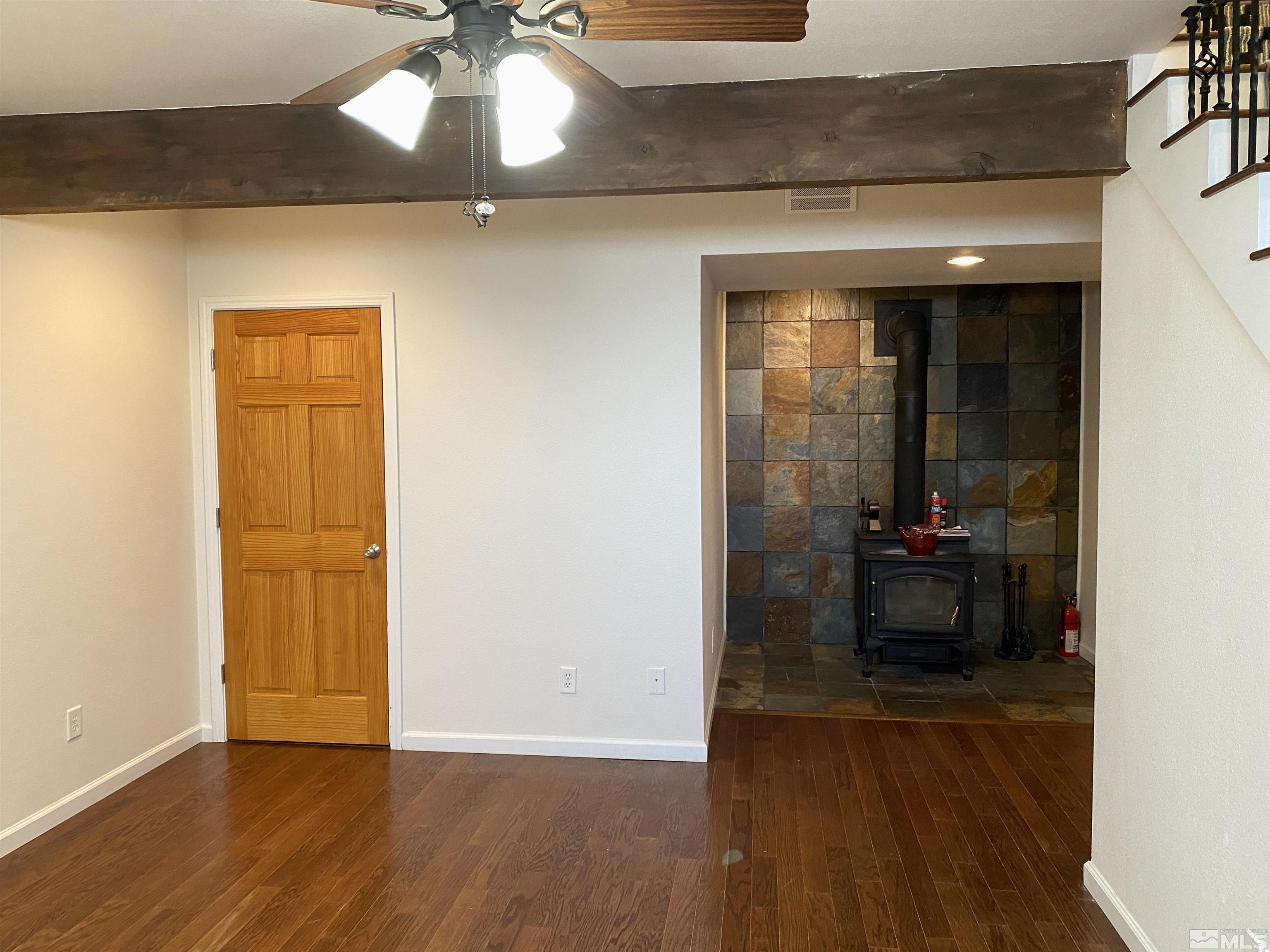 21440 Delta Drive Reno, NV 89521 - Photo 16 of 25 a view of a room with wooden floor and a potted plant