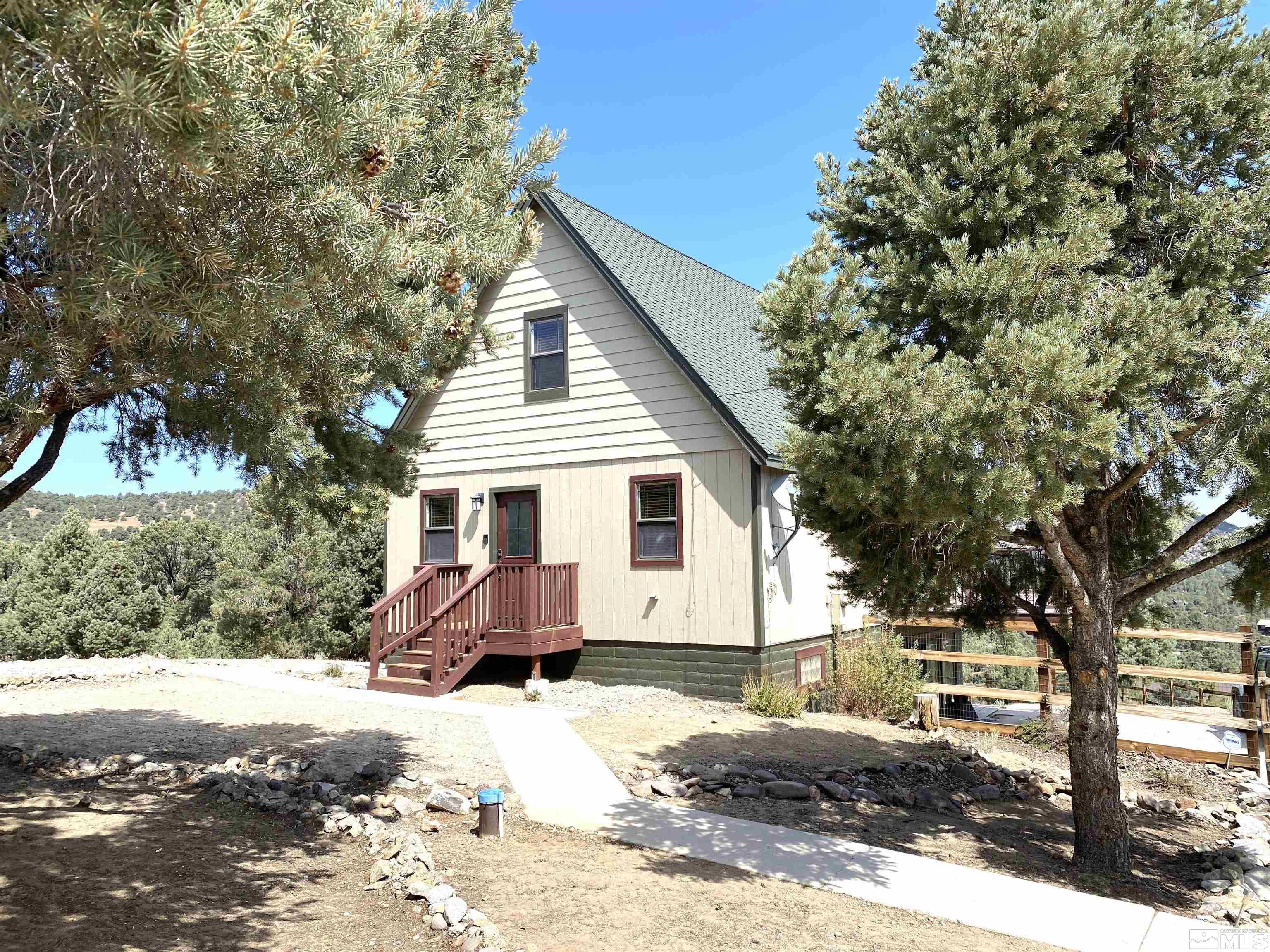 21440 Delta Drive Reno, NV 89521 - Photo 3 of 25 a view of a house with a yard covered in snow