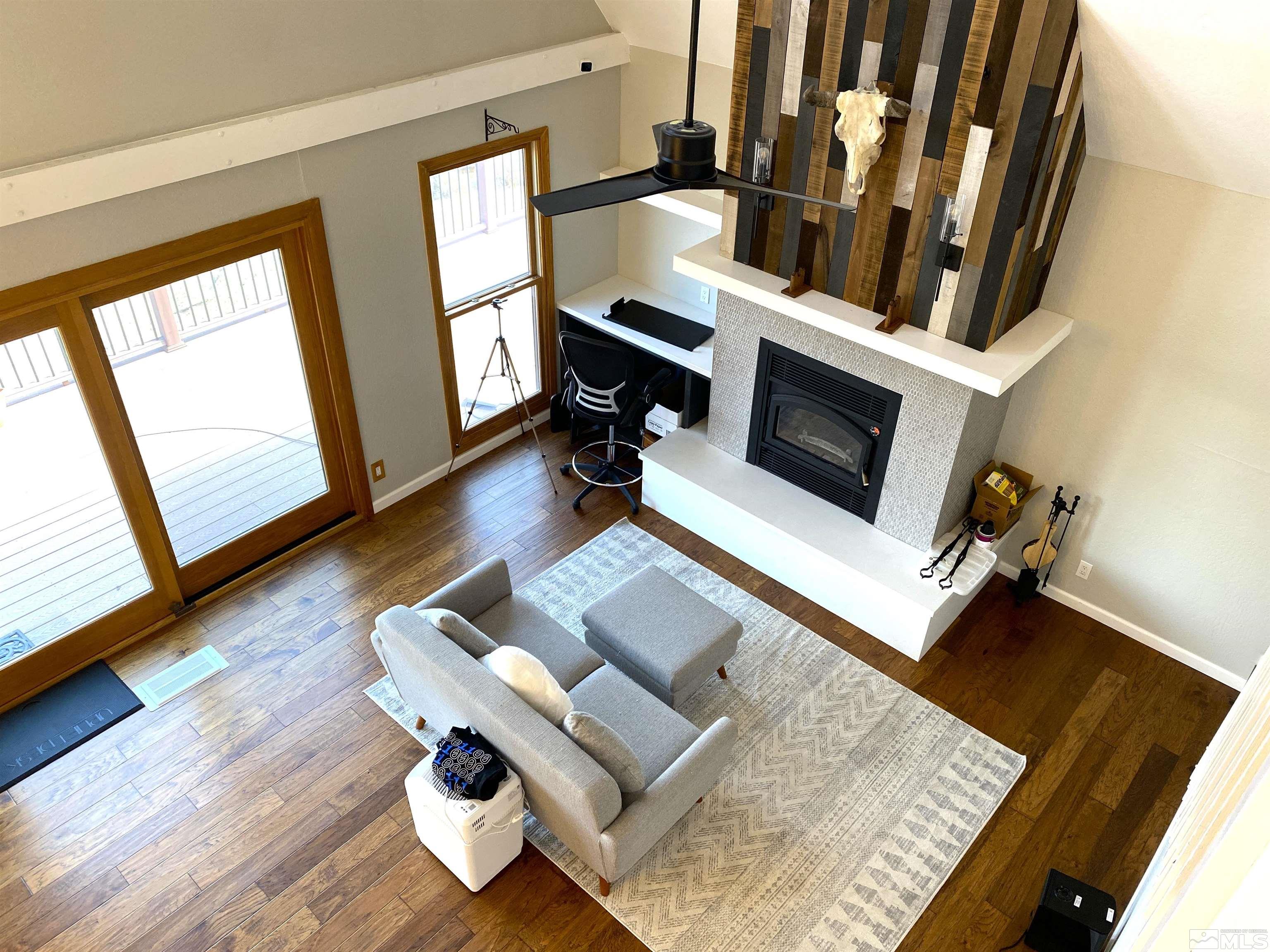 21440 Delta Drive Reno, NV 89521 - Photo 8 of 25 a living room with furniture and a fireplace