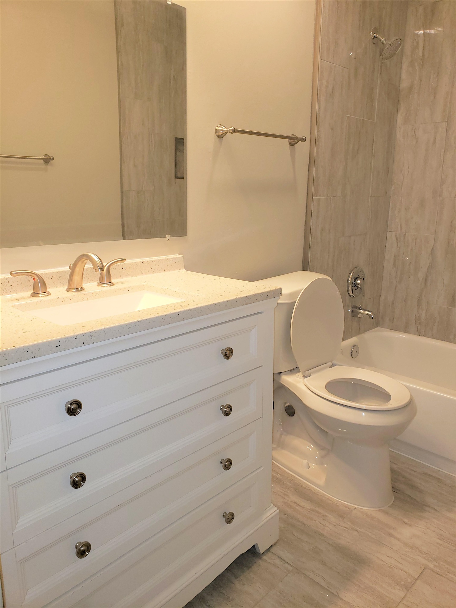 2596 Lynnfield Road Memphis, TN 38119 - Photo 14 of 23 a bathroom with a granite countertop toilet a sink a mirror and shower