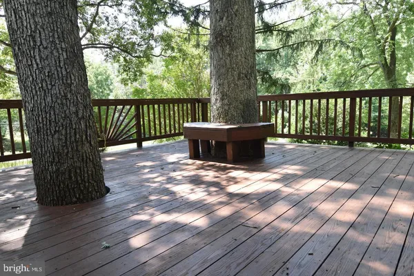 a view of a wooden deck with a bench
