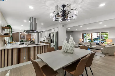 a kitchen with stainless steel appliances a stove sink and refrigerator