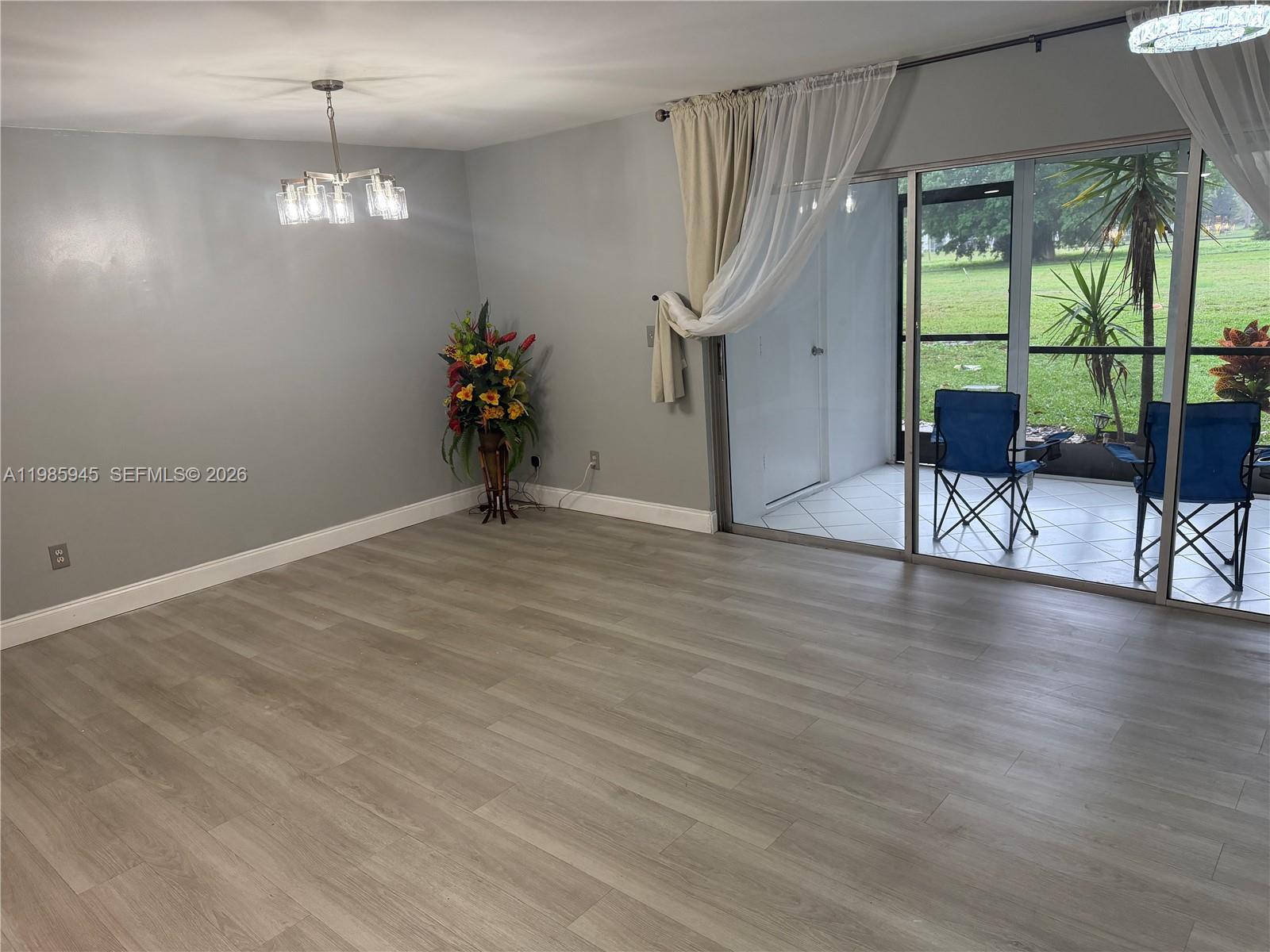 3962 Inverrary Drive, Unit A3 Lauderhill, FL 33319 - Photo 14 of 42 a view of a livingroom with furniture window wooden floor and windows