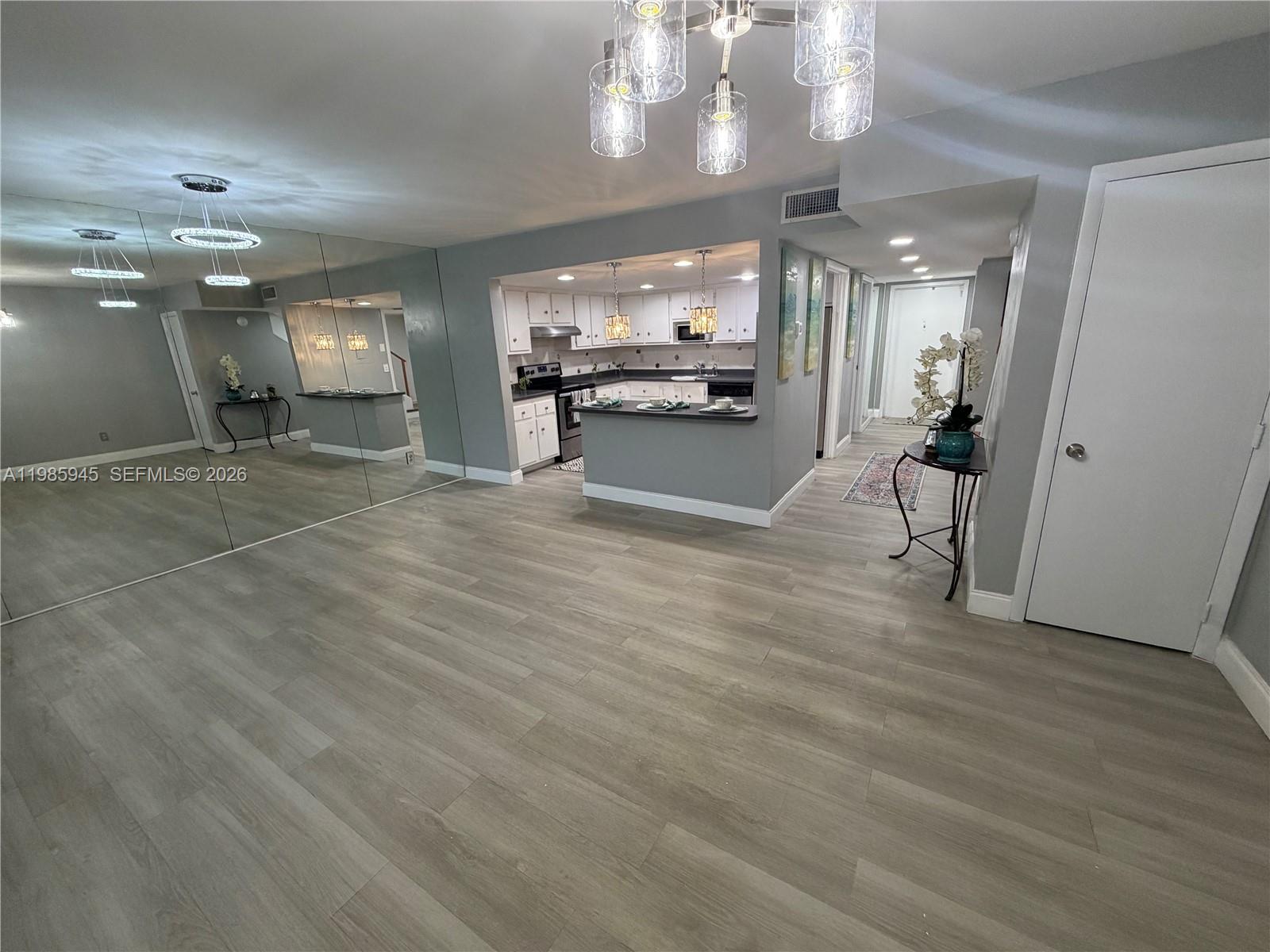 3962 Inverrary Drive, Unit A3 Lauderhill, FL 33319 - Photo 16 of 42 a view of a room with wooden floor