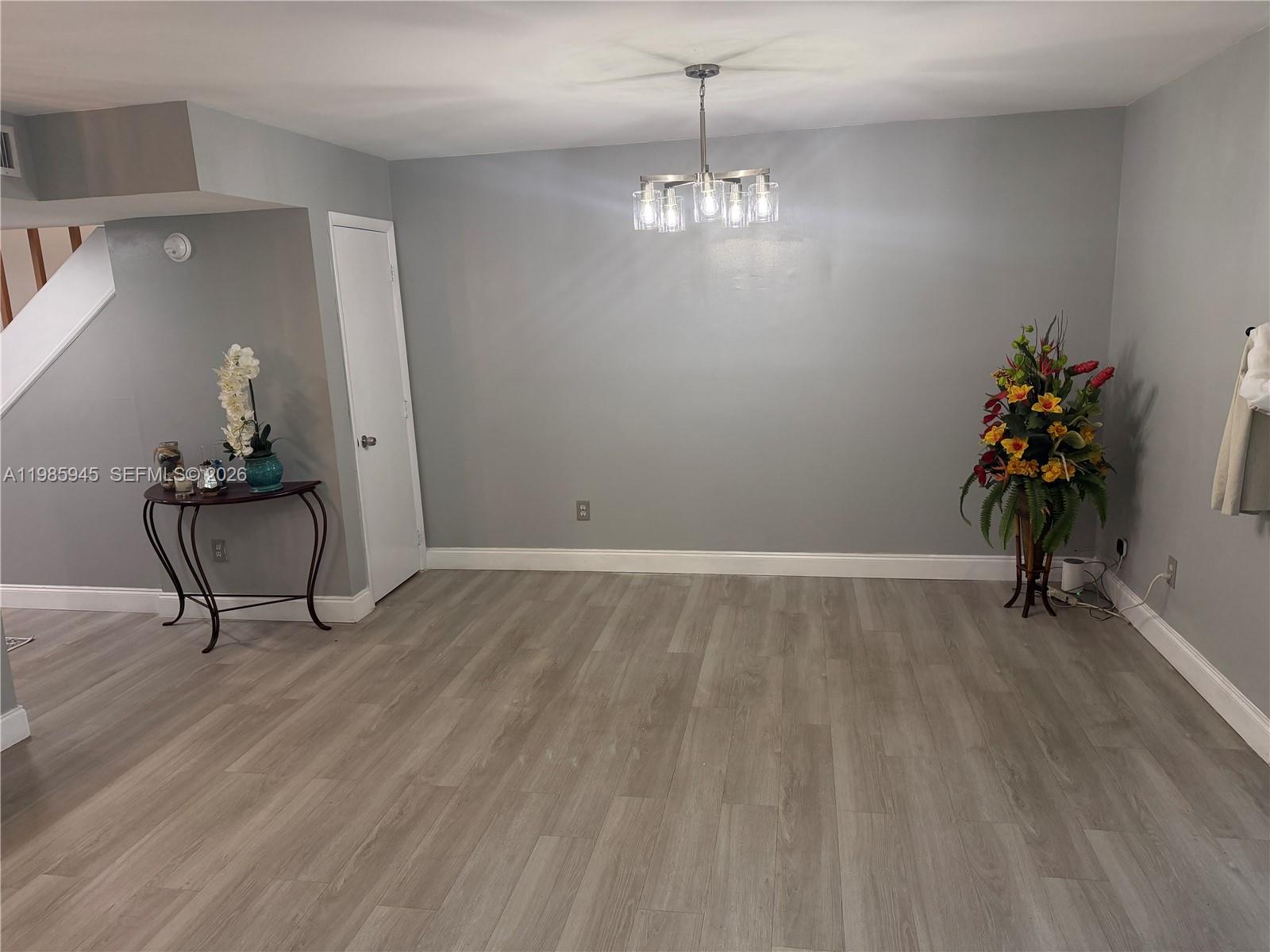 3962 Inverrary Drive, Unit A3 Lauderhill, FL 33319 - Photo 18 of 42 a view of an empty room and wooden floor