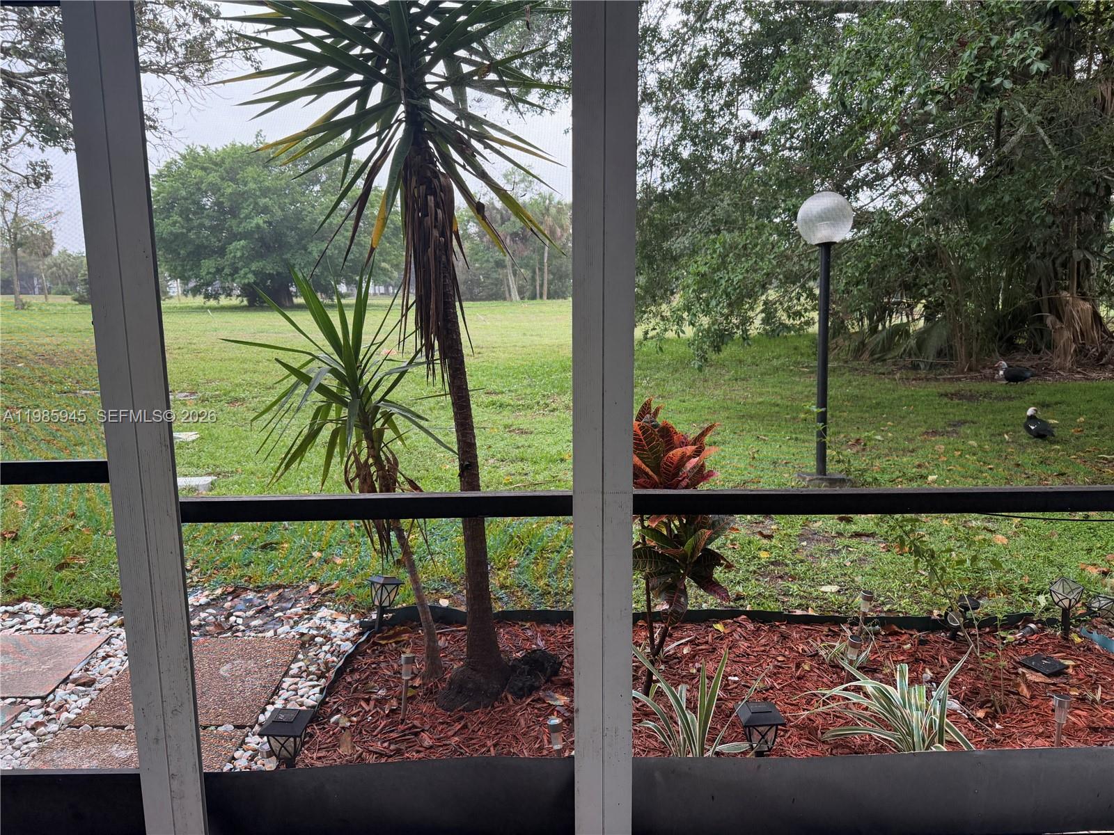 3962 Inverrary Drive, Unit A3 Lauderhill, FL 33319 - Photo 21 of 42 a view of a small yard from a balcony