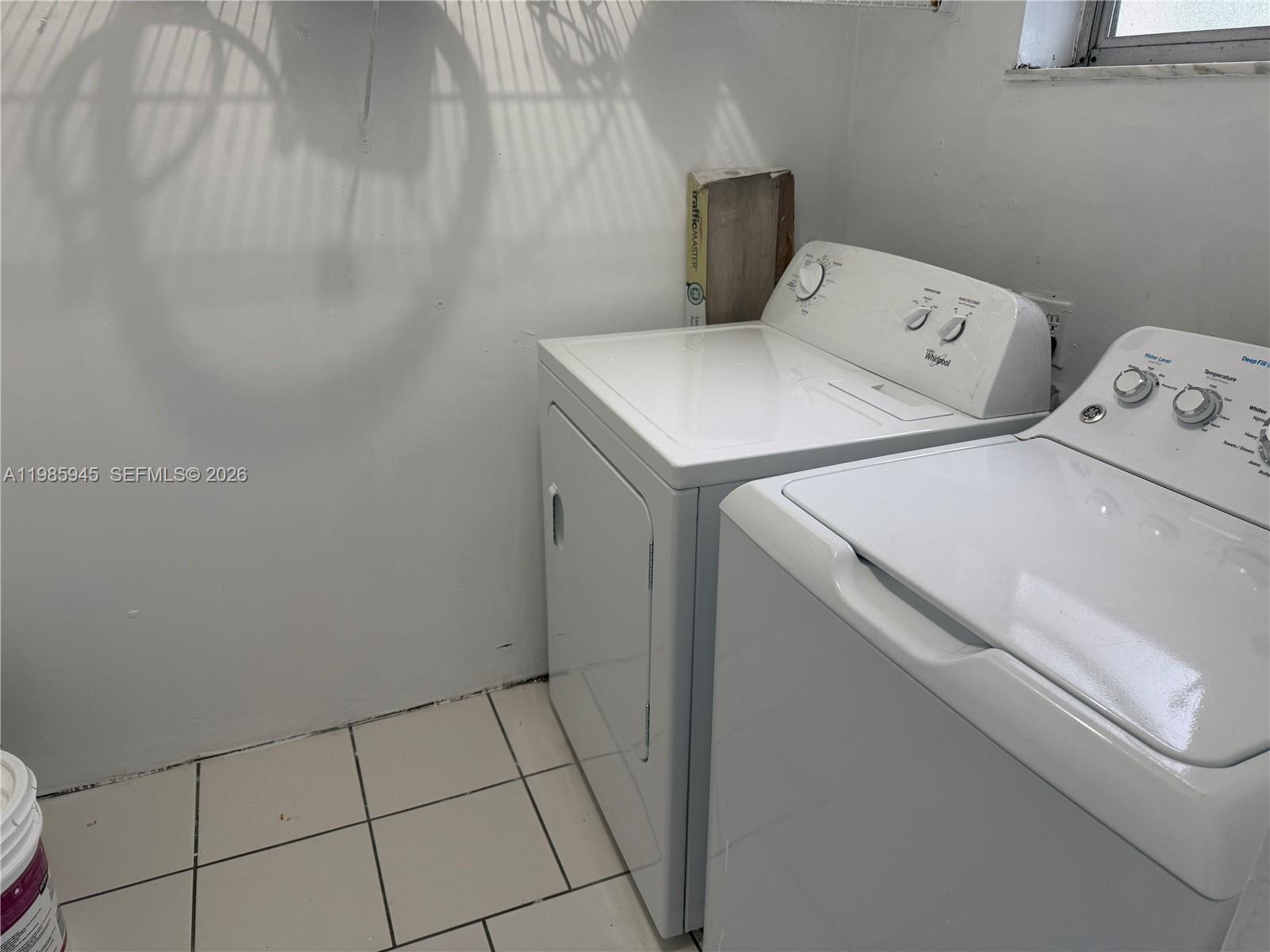 3962 Inverrary Drive, Unit A3 Lauderhill, FL 33319 - Photo 23 of 42 a utility room with dryer and washer
