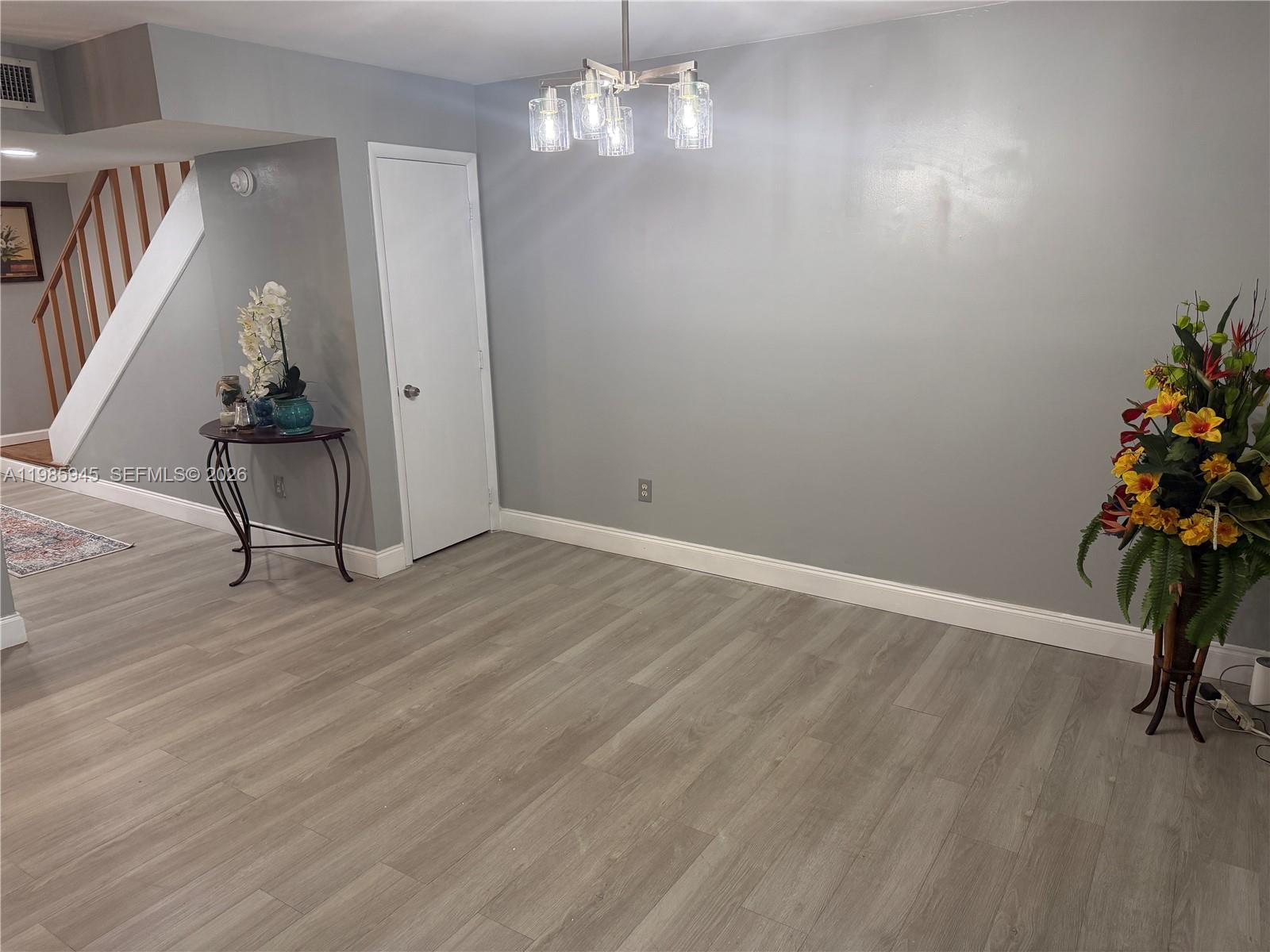 3962 Inverrary Drive, Unit A3 Lauderhill, FL 33319 - Photo 24 of 42 wooden floor in an empty room with a window