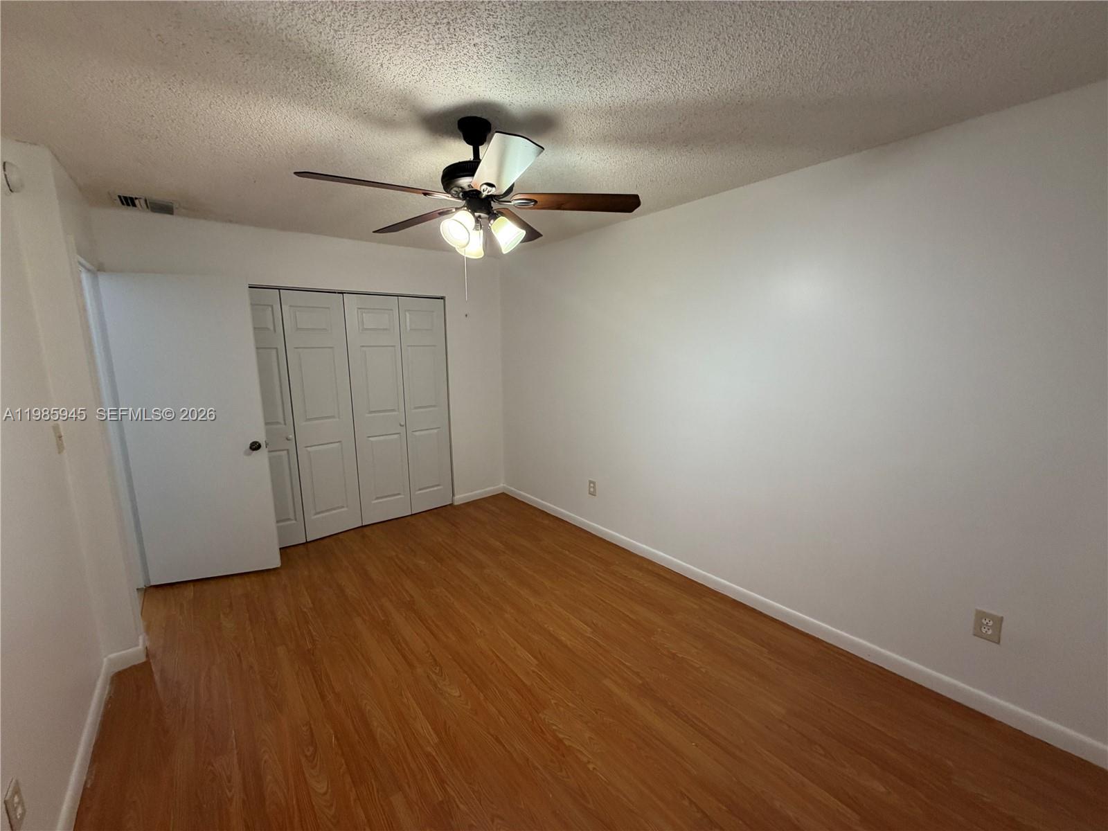 3962 Inverrary Drive, Unit A3 Lauderhill, FL 33319 - Photo 36 of 42 a view of empty room with wooden floor